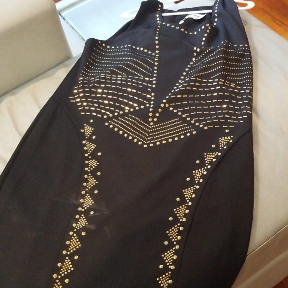 Black sleeveless gold beaded front.